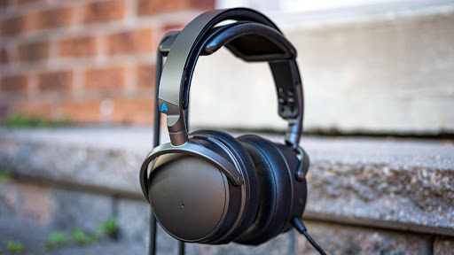 Audeze Maxwell Wireless rests on a ledge showing their sleek design